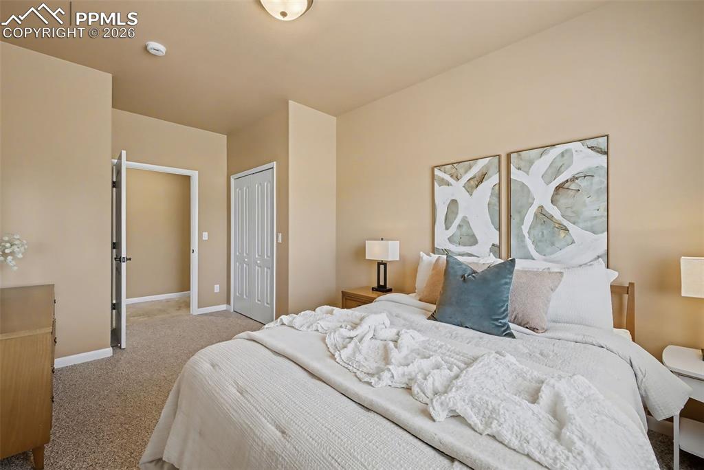 Image 32 of 45: Primary walk-in closet