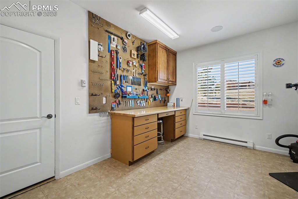 Image 36 of 45: Main level full bathroom with double vanity and granite countertops
