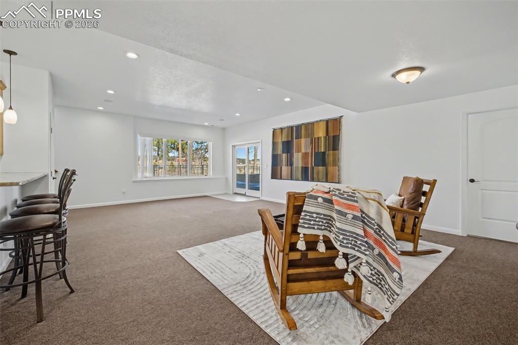 Image 37 of 45: Heated workshop off of the garage to include sink and cabinetry