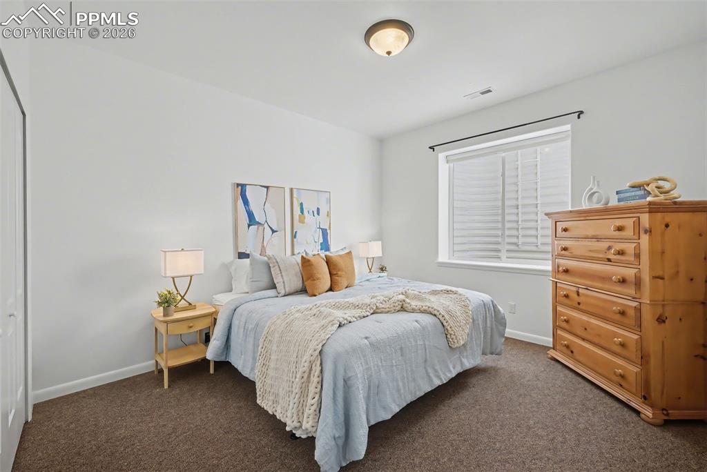 Image 40 of 45: Basement kitchen/wet bar with entrance to the wine cellar.