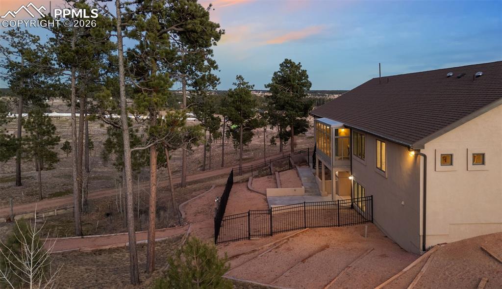 Image 5 of 45: Enclosed upper patio area to enjoy the outdoors year round as well as a fen