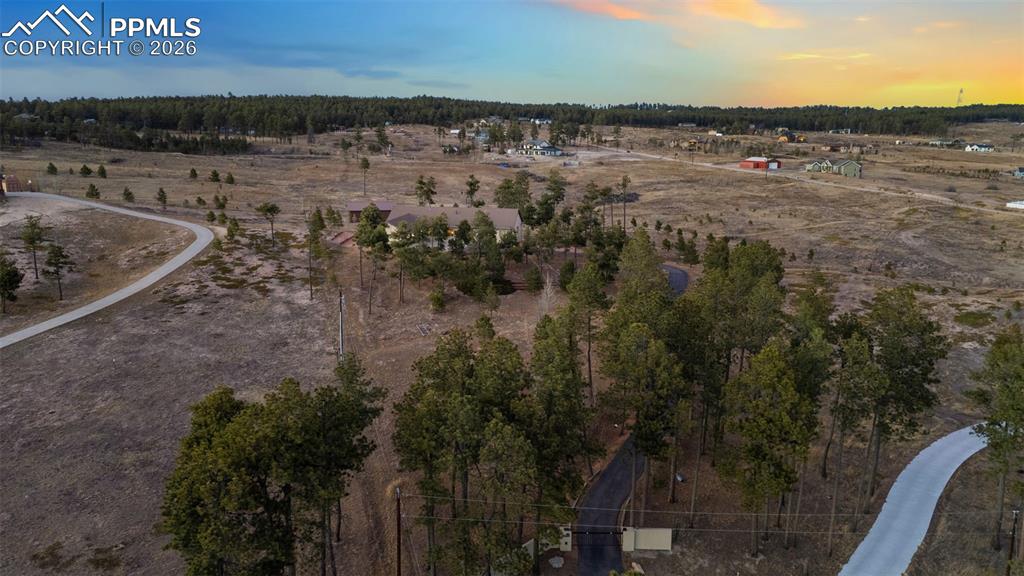 Image 8 of 45: Over 5.5 acres of treed perfection with pole barn and greenhouse!