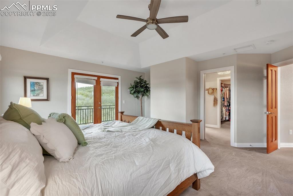 Image 23 of 49: Bedroom with access to exterior, light carpet, french doors, baseboards, an