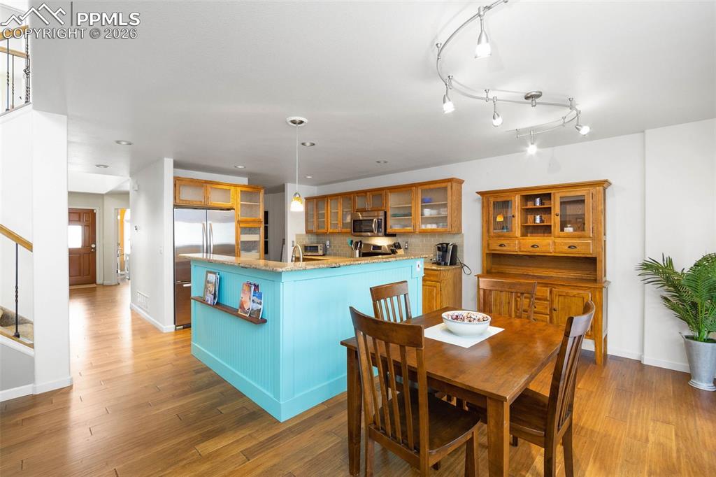 Image 13 of 31: Open space with access to the front door, kitchen and office