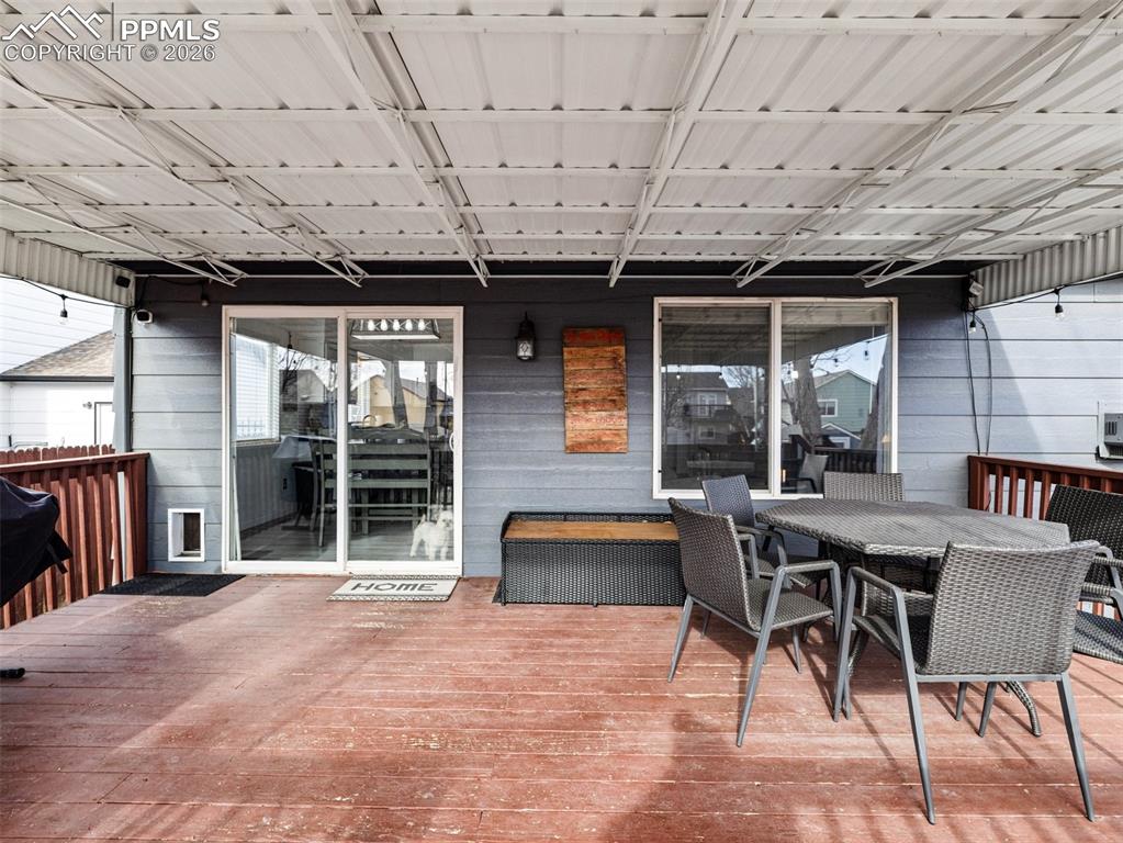 Image 31 of 31: Deck featuring outdoor dining space and area for grilling