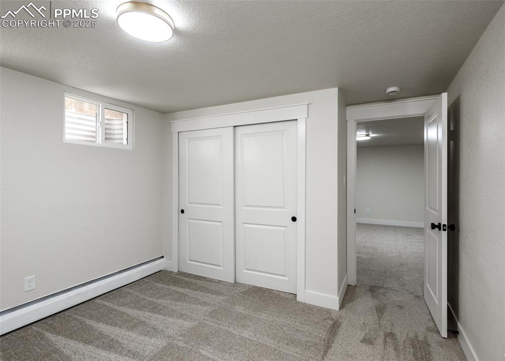 Image 40 of 50: 3rd bedroom in basement