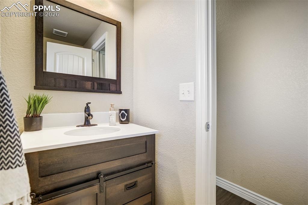 Image 20 of 49: Powder bathroom on the main level. 