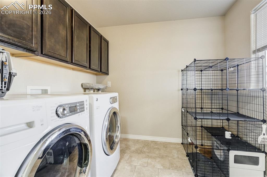 Image 41 of 49: Laundry room is also upstairs & has additional storage. 