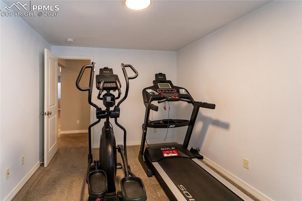 Image 27 of 35: BR 5 doubling as a home Gym.
