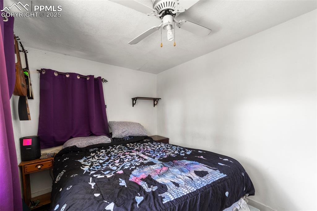 Image 16 of 31: Bedroom featuring a ceiling fan