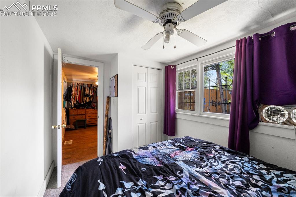 Image 17 of 31: Bedroom featuring a closet, carpet flooring, and a ceiling fan