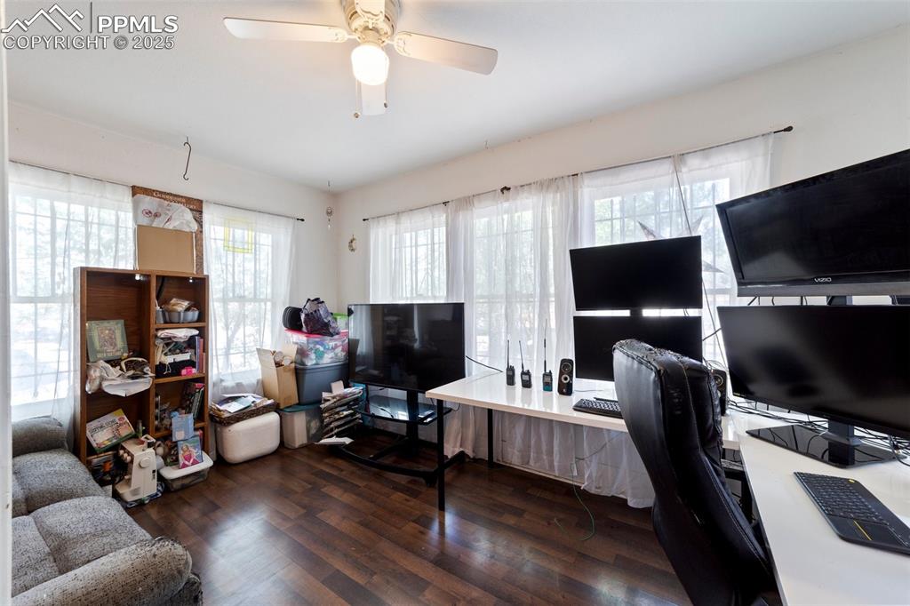 Image 5 of 31: Office featuring wood finished floors and a ceiling fan