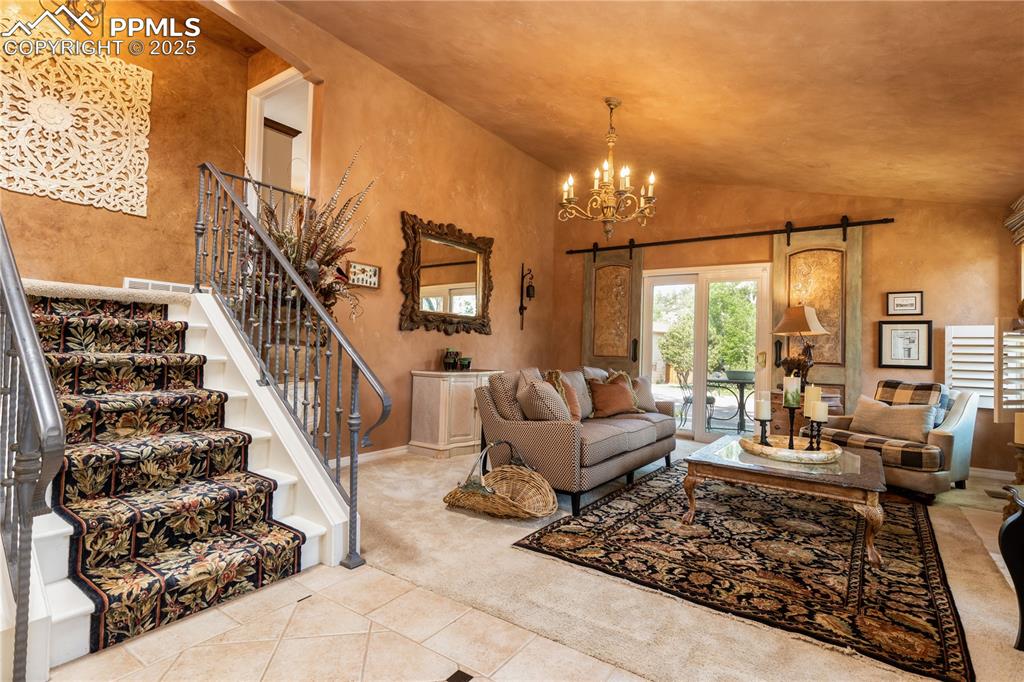 Image 5 of 49: Elegant staircase to main bedroom suite and second bedroom.