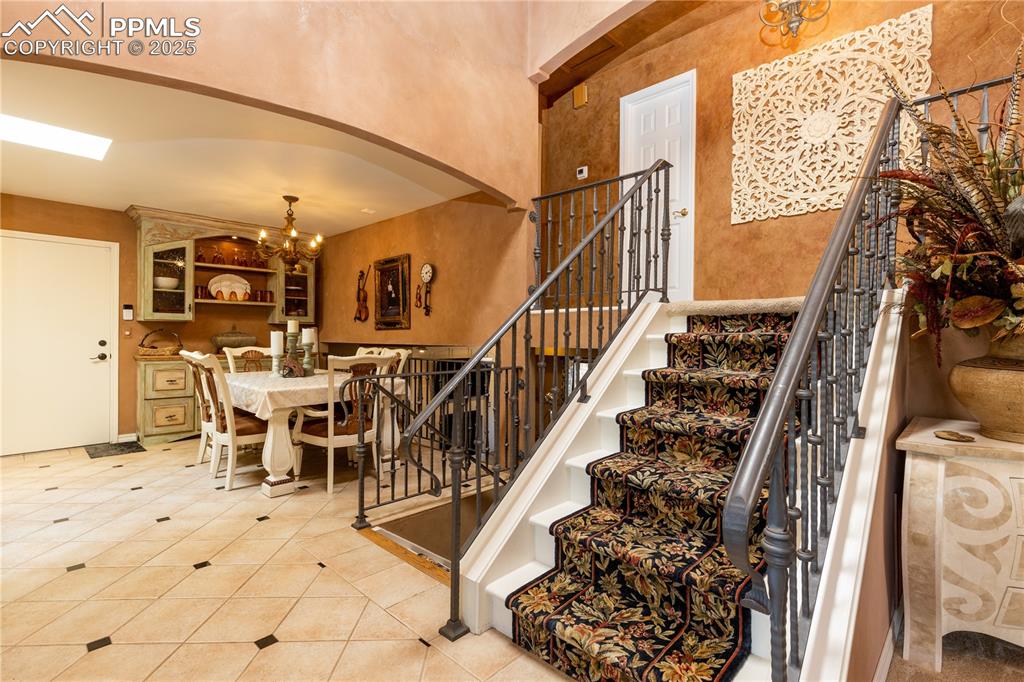Image 6 of 49: From entry toward spacious dining area. Note the custom high quality metal