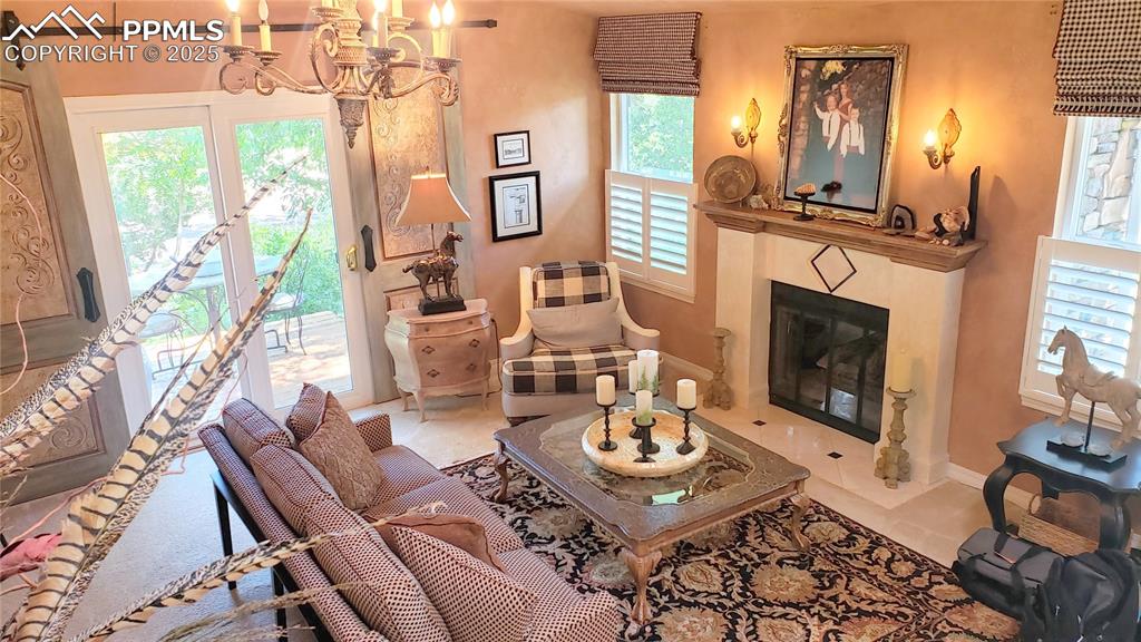 Image 7 of 49: As seen from the stair case. Gas Fireplace with marble hearth.