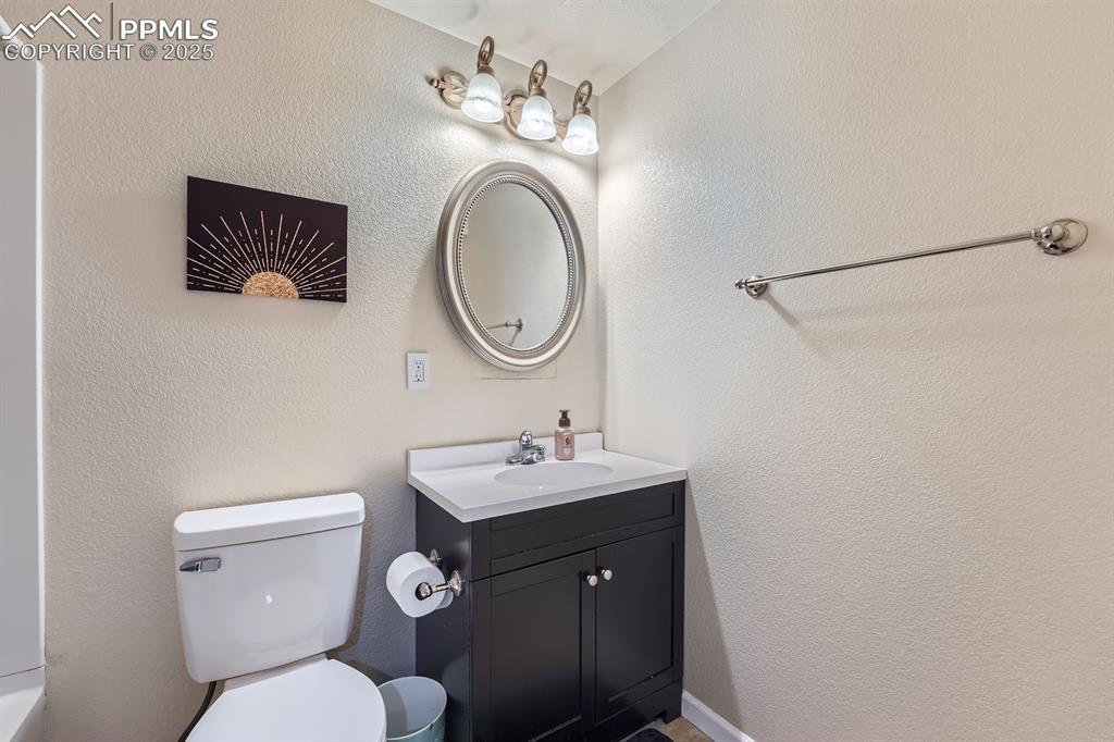 Image 24 of 28: Bathroom featuring vanity and toilet