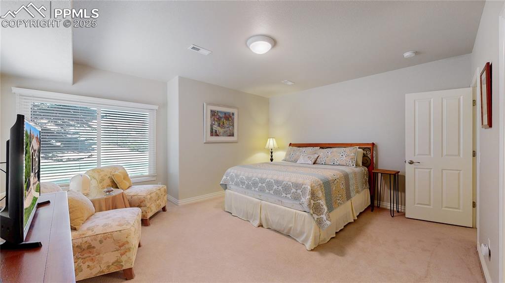 Image 28 of 46: Bedroom featuring carpet and baseboards