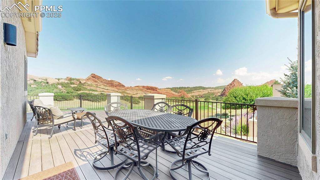 Image 33 of 46: Wooden terrace with outdoor dining space