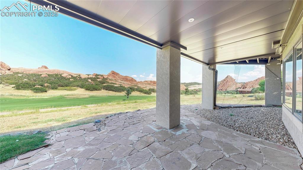 Image 37 of 46: View of patio featuring a mountain view