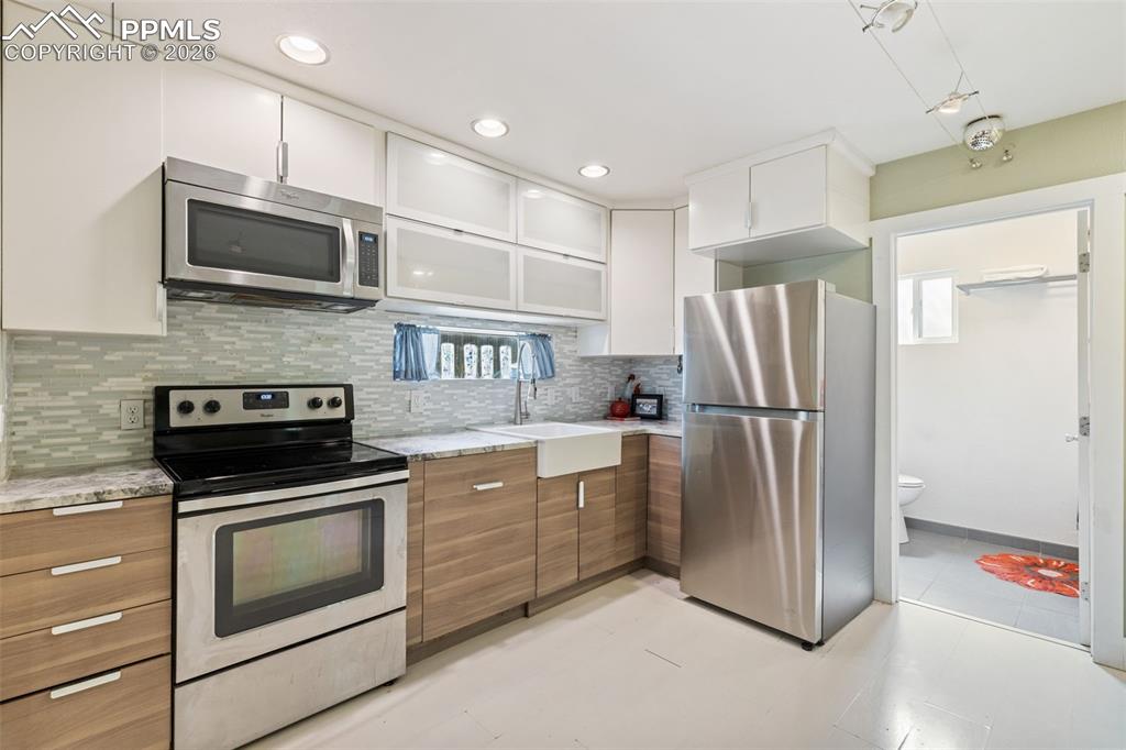 Image 10 of 35: Lots of Cabinets and Drawers for all Your Kitchen Essentials!