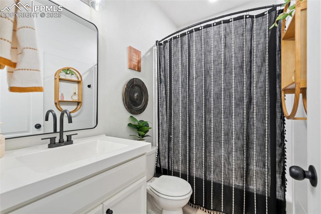 Image 14 of 22: Full bathroom featuring vanity and shower / tub combo