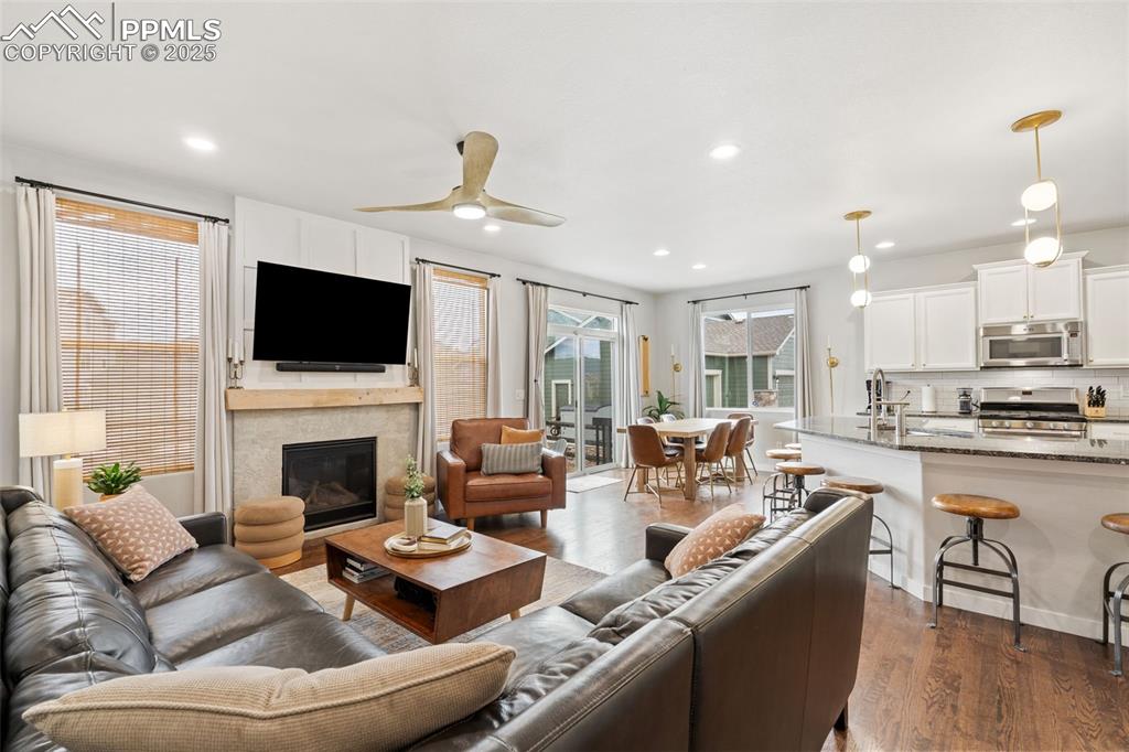 Image 5 of 22: Living room featuring recessed lighting, dark wood-type flooring, a ceiling