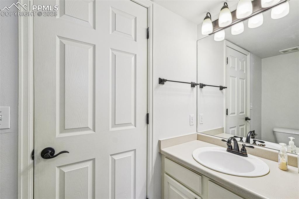 Image 17 of 46: Bathroom featuring vanity and toilet