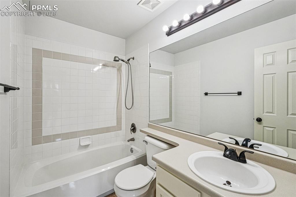 Image 27 of 46: Full bath with shower / bathtub combination and vanity