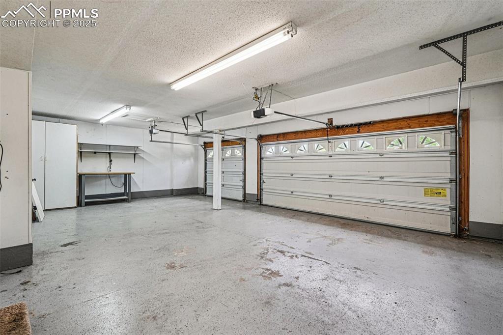 Image 39 of 46: Garage with baseboards