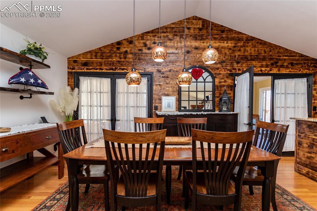 Image 17 of 50: Plenty of room to entertain, French doors out to sun room.