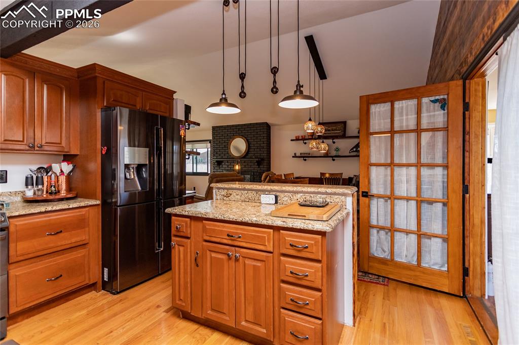 Image 25 of 50: Open to dining room & living room - makes entertaining a breeze.