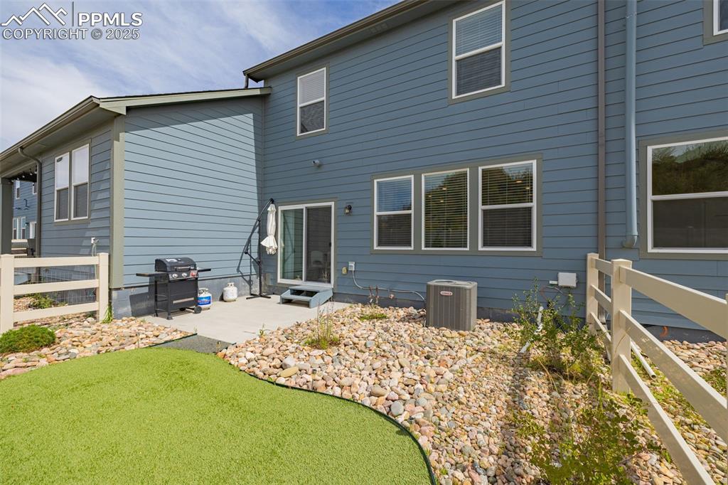 Image 28 of 35: Rear view of property with a patio area