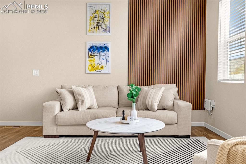 Image 4 of 35: Sitting room featuring baseboards and wood finished floors