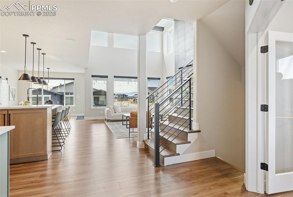 Image 10 of 47: Glistening Luxury Plank Flooring Throughout