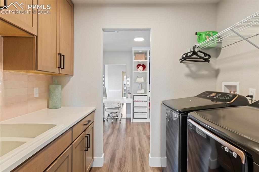 Image 32 of 47: Fantastic Full-Service Laundry Space Connected to Primary Closet