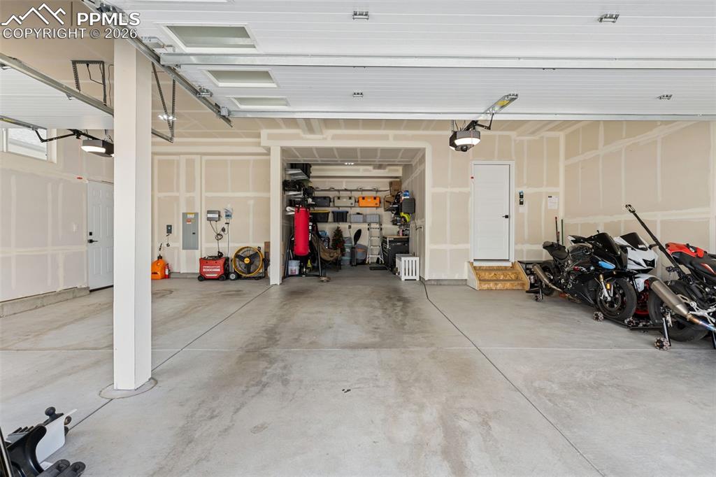 Image 41 of 47: Massive Four Car Garage w/Tandem 4th Bath