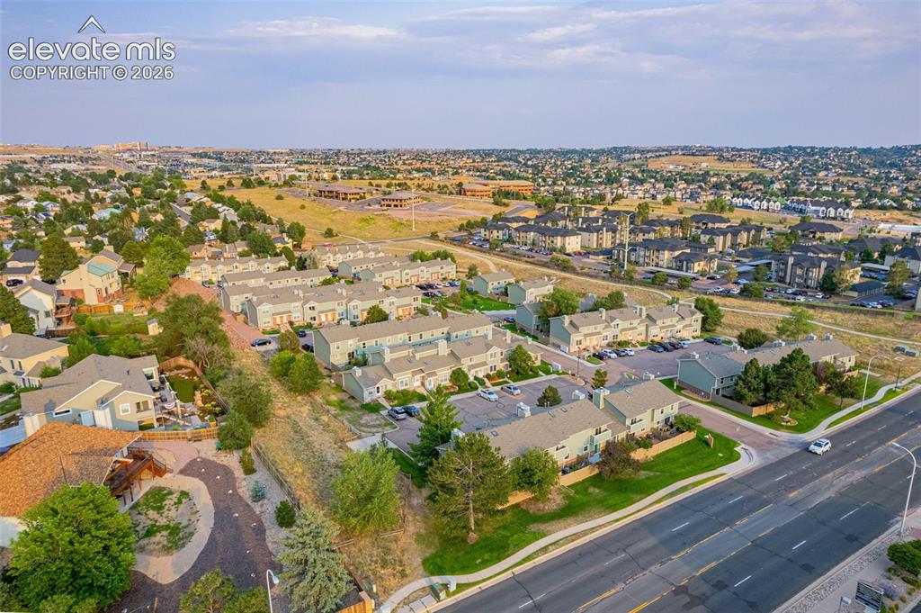 Image 28 of 32: Aerial perspective showcasing a residential community with multi-story buil