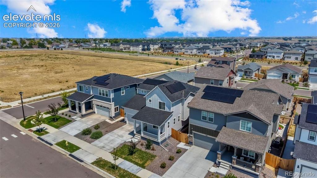 Image 30 of 38: Modern residential architecture with solar panel installations