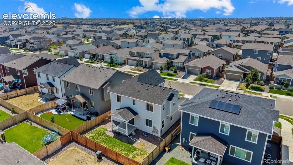 Image 31 of 38: Newer construction residential architecture with solar panels, a covered pa