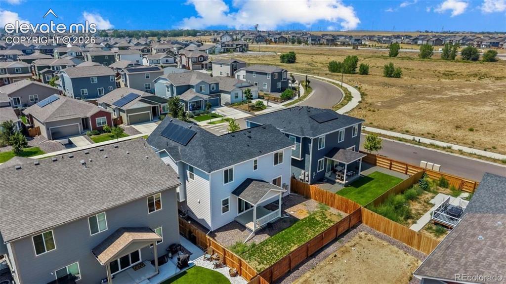 Image 32 of 38: Residential neighborhood featuring a variety of single-family homes, paved 
