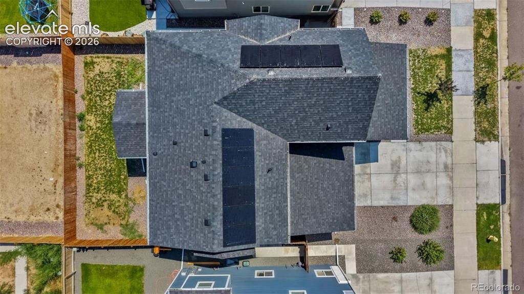 Image 33 of 38: Asphalt shingle roof with integrated solar panels