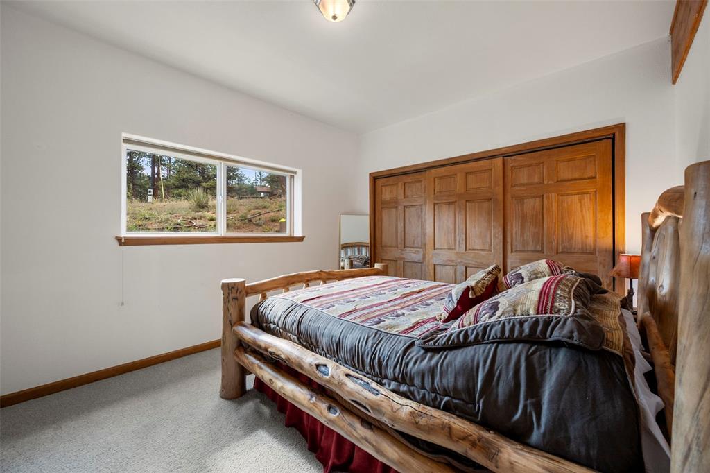 Image 17 of 38: Basement bedroom