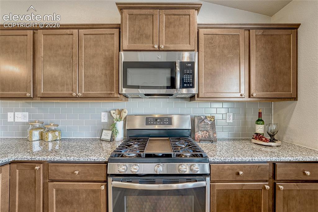 Image 10 of 47: Cooking and entertaining are made easy with a modern kitchen layout featuri