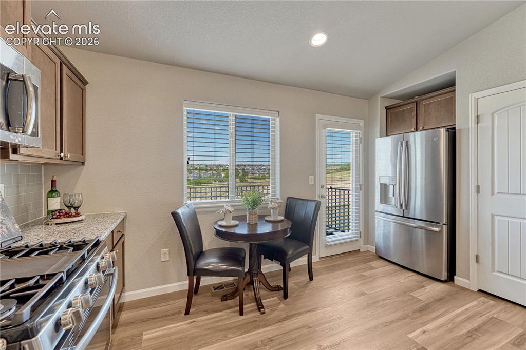 Image 13 of 47: The dining nook extends the kitchen living space while you have the option