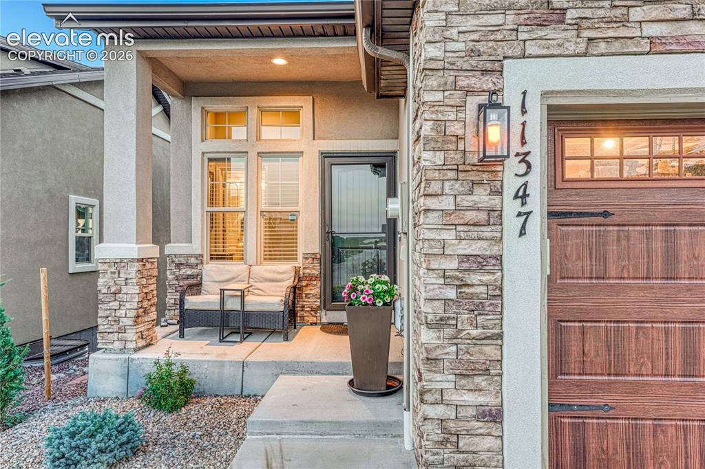 Image 2 of 47: A welcoming, south-facing, covered front porch creates the perfect first im