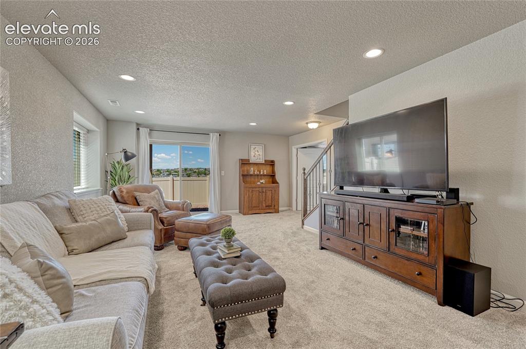 Image 25 of 47: Create your ideal entertainment space in the finished basement, offering ro