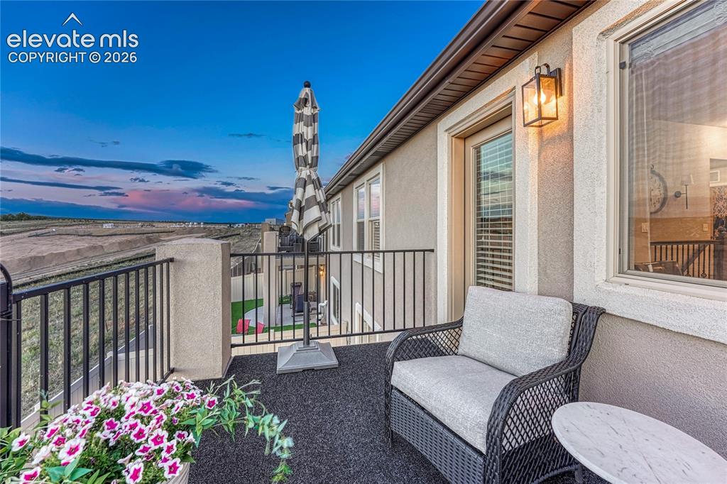 Image 35 of 47: The upper-level balcony provides a peaceful place to enjoy fresh air, morni