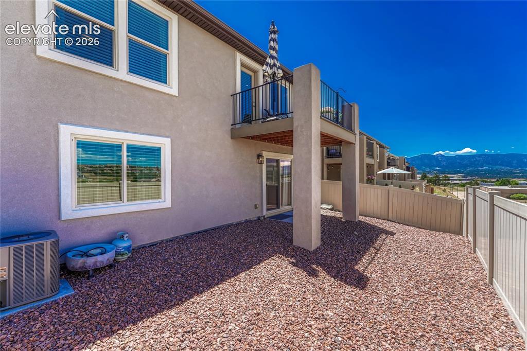 Image 40 of 47: The rear exterior offers easy outdoor living with a low-maintenance yard, c