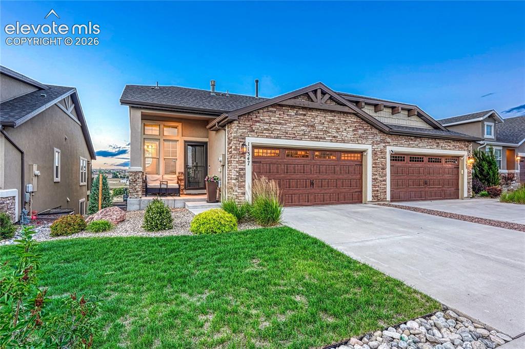 Image 44 of 47: This charming patio home welcomes you with a beautiful stucco and stone ext