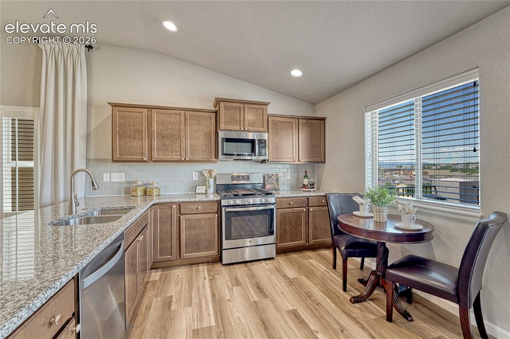 Image 9 of 47: The well-designed kitchen combines function and style with granite countert